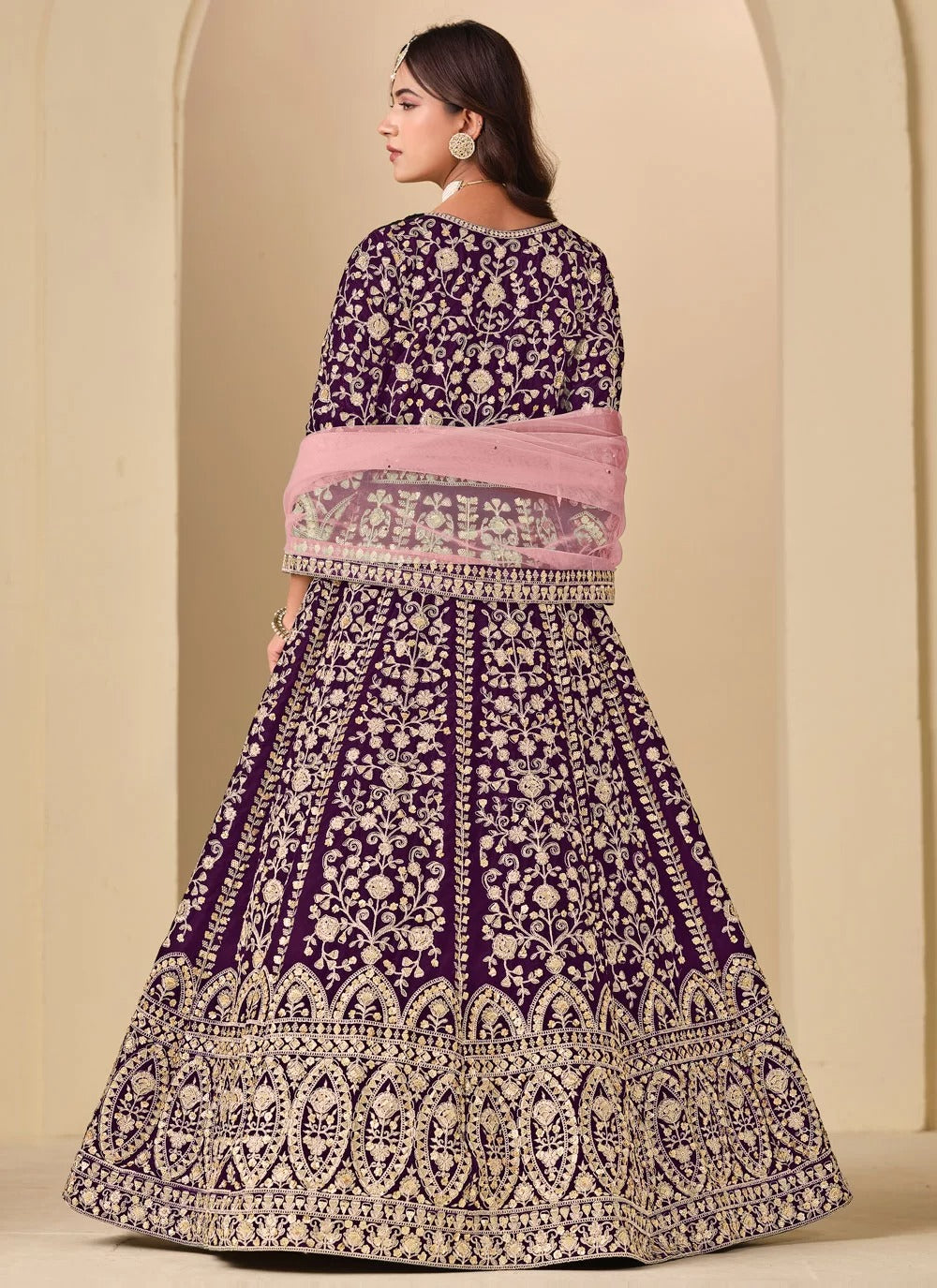 Luxurious purple velvet anarkali suit with front back embroidery