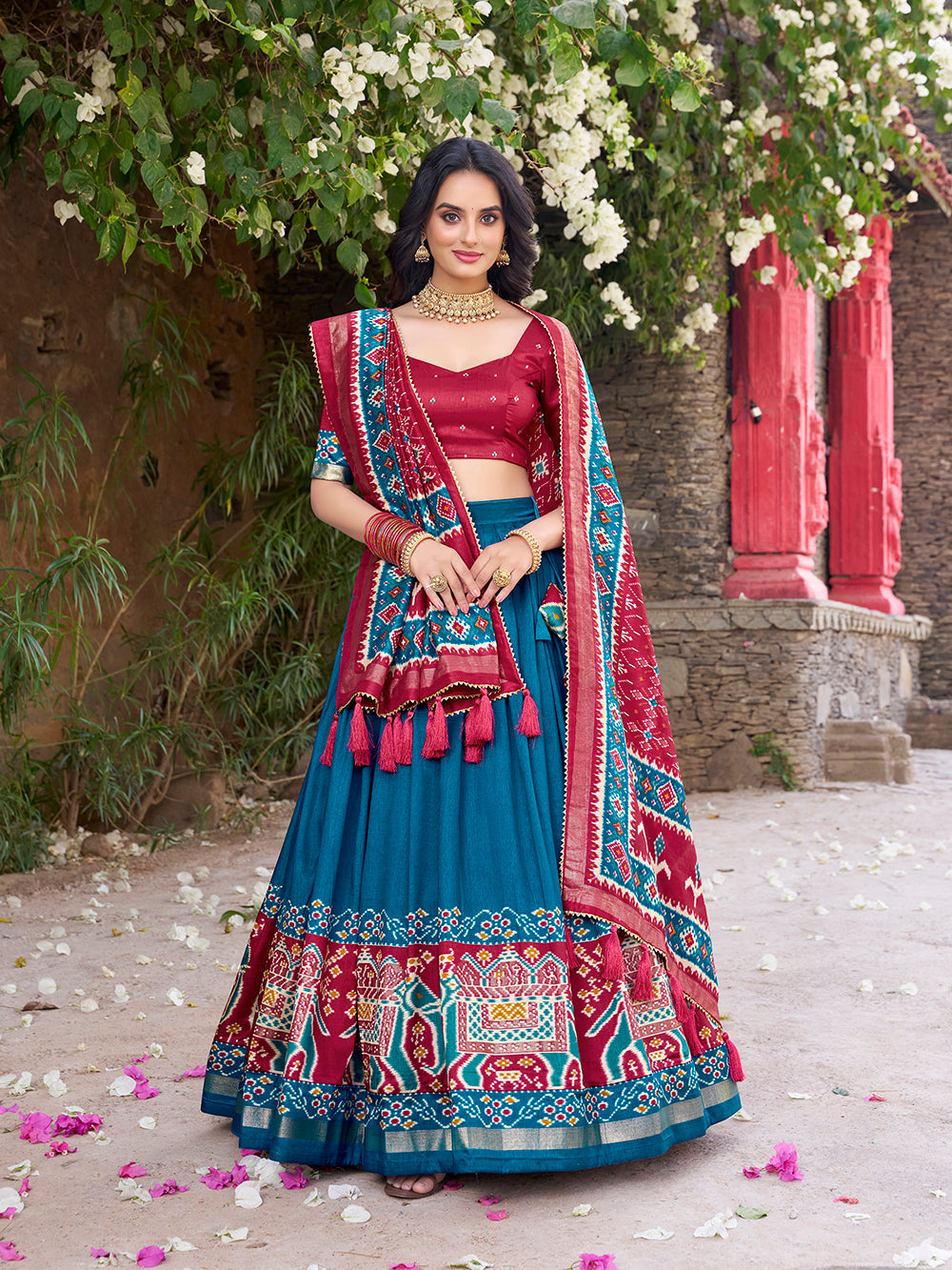 Teal tasar silk lehenga choli with patola print foil work matching dupatta