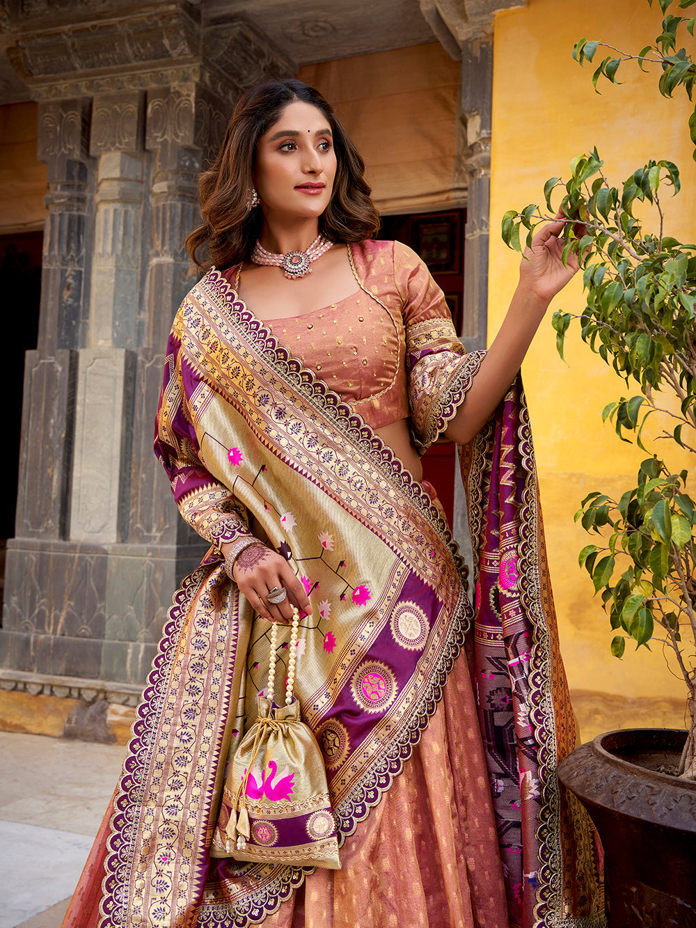 Peach shimmer organza lehenga choli with zari weaving paithani dupatta purse
