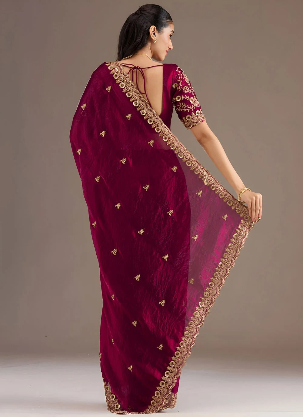 Opulent maroon tissue silk saree with zari dori sequins embroidery