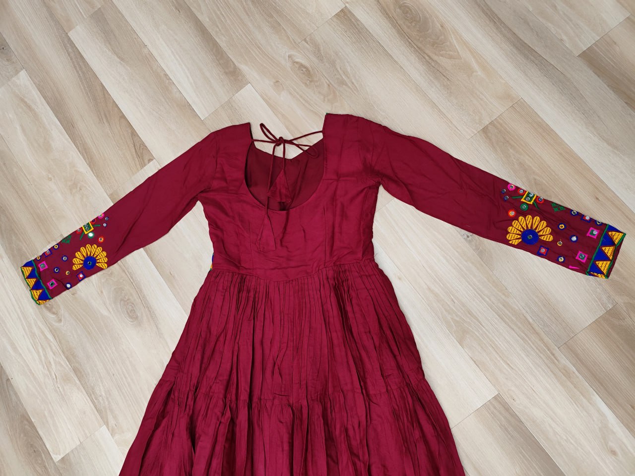 Maroon Navratri Special Kutchi Gamthi Work Gown in 14 Kg Rayon with 4-Layer Frill & Full Sleeves