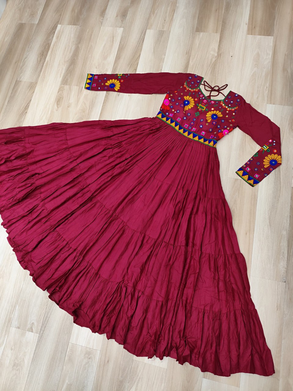 Maroon Navratri Special Kutchi Gamthi Work Gown in 14 Kg Rayon with 4-Layer Frill & Full Sleeves
