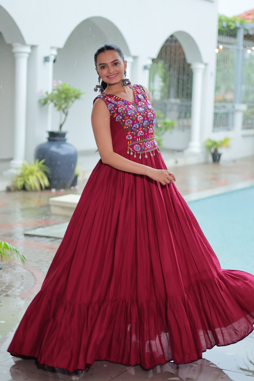Maroon Rayon Navratri Gown with Kutchi Gamthi Embroidery & Mirror Work – Sleeveless with Flair
