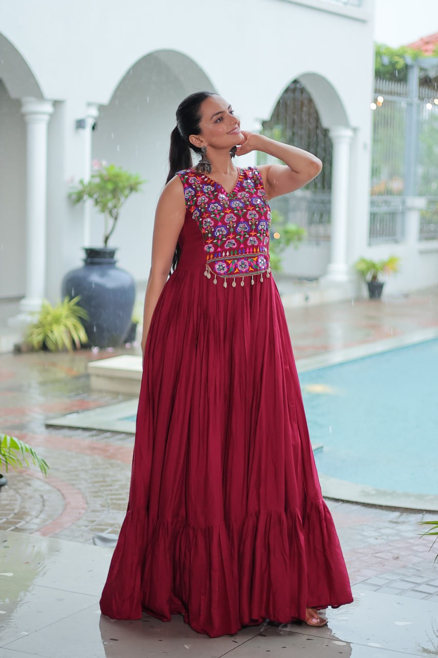 Maroon Rayon Navratri Gown with Kutchi Gamthi Embroidery & Mirror Work – Sleeveless with Flair
