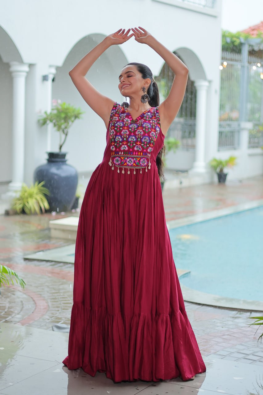 Maroon Rayon Navratri Gown with Kutchi Gamthi Embroidery & Mirror Work – Sleeveless with Flair