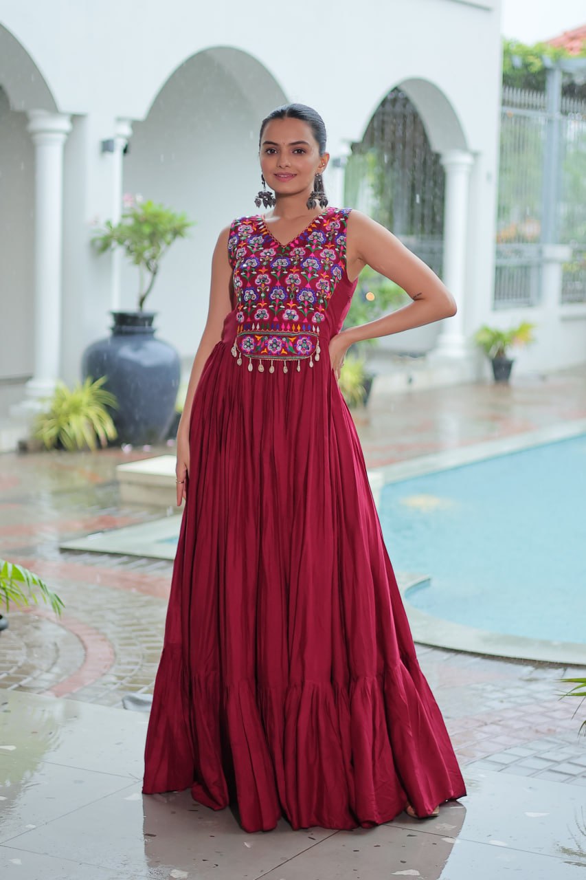 Maroon Rayon Navratri Gown with Kutchi Gamthi Embroidery & Mirror Work – Sleeveless with Flair