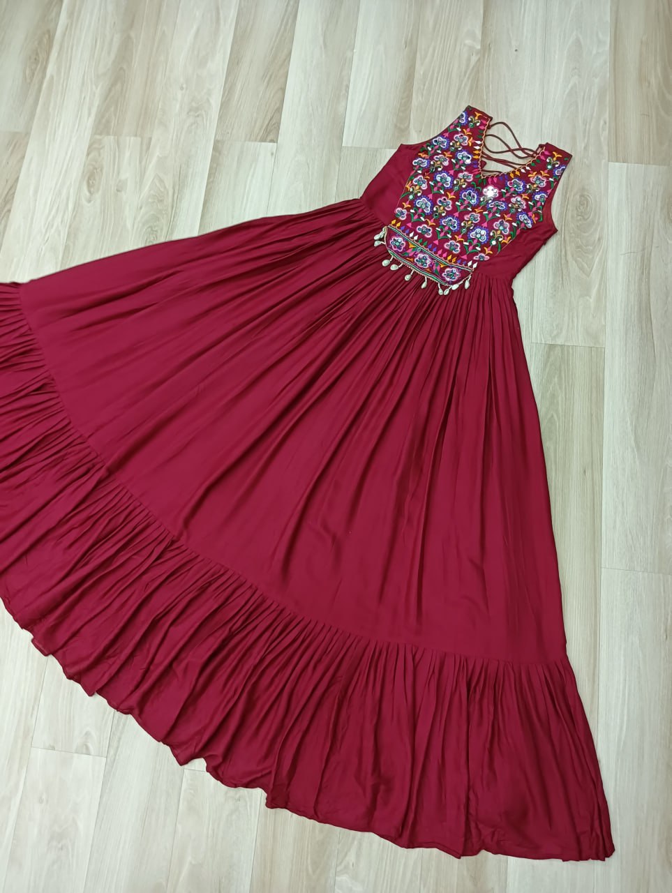 Maroon Rayon Navratri Gown with Kutchi Gamthi Embroidery & Mirror Work – Sleeveless with Flair