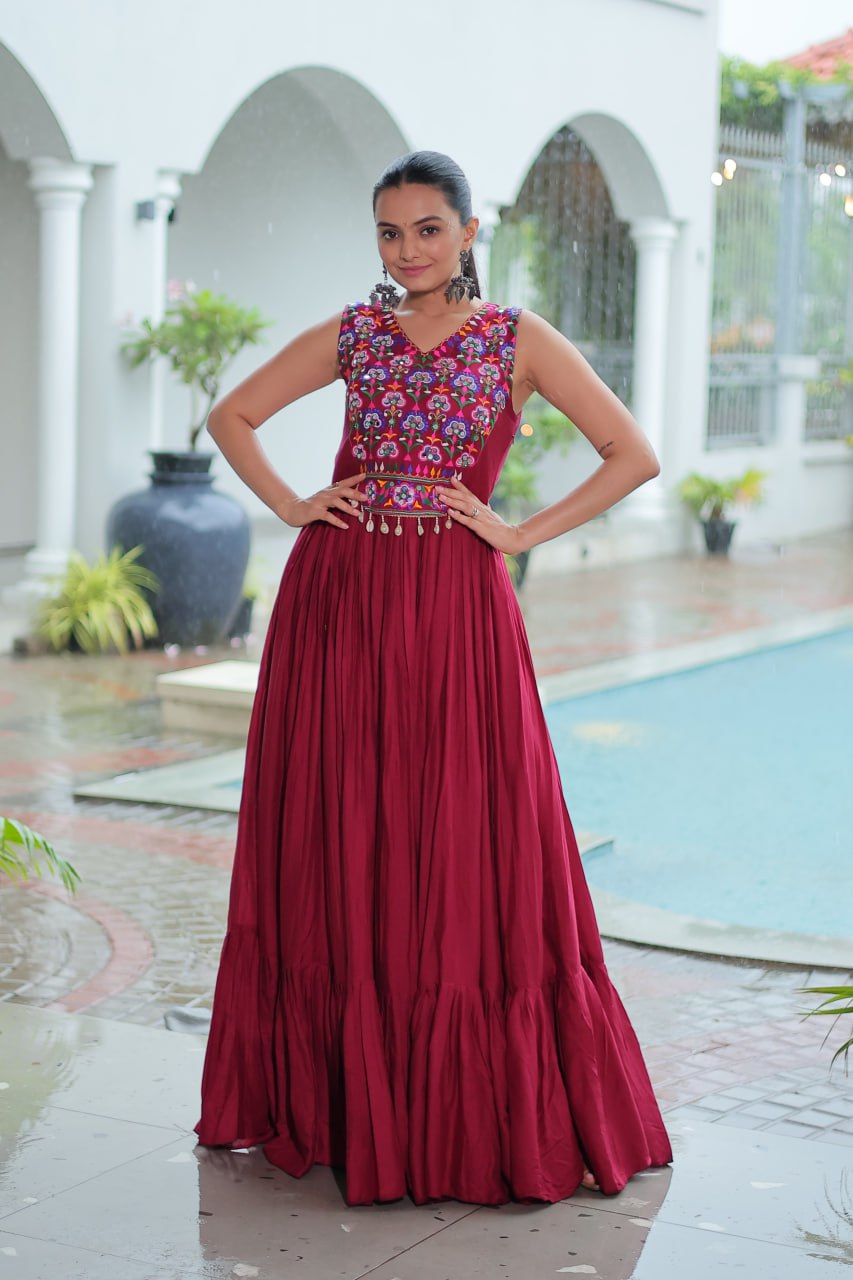 Maroon Rayon Navratri Gown with Kutchi Gamthi Embroidery & Mirror Work – Sleeveless with Flair