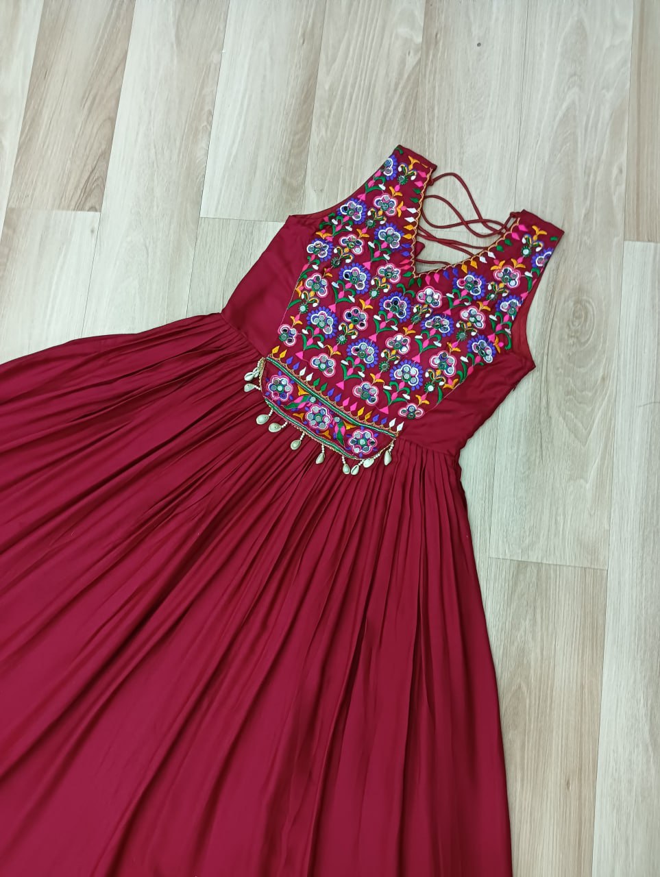 Maroon Rayon Navratri Gown with Kutchi Gamthi Embroidery & Mirror Work – Sleeveless with Flair