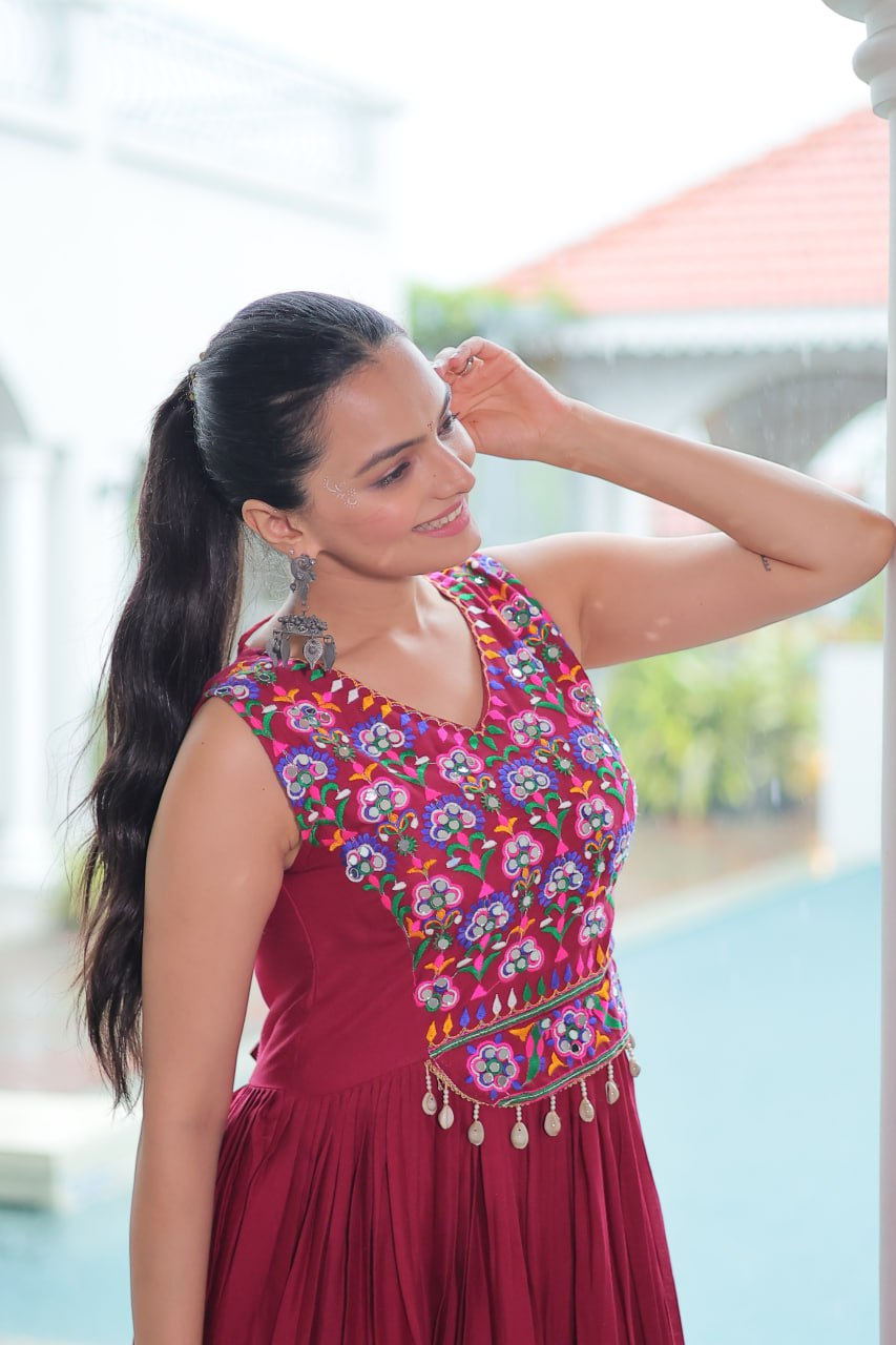 Maroon Rayon Navratri Gown with Kutchi Gamthi Embroidery & Mirror Work – Sleeveless with Flair