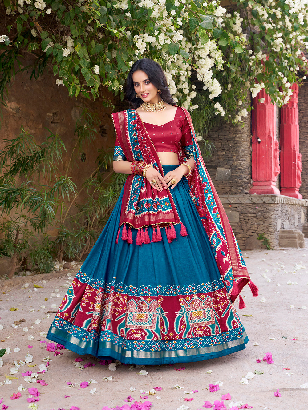 Teal tasar silk lehenga choli with patola print foil work matching dupatta