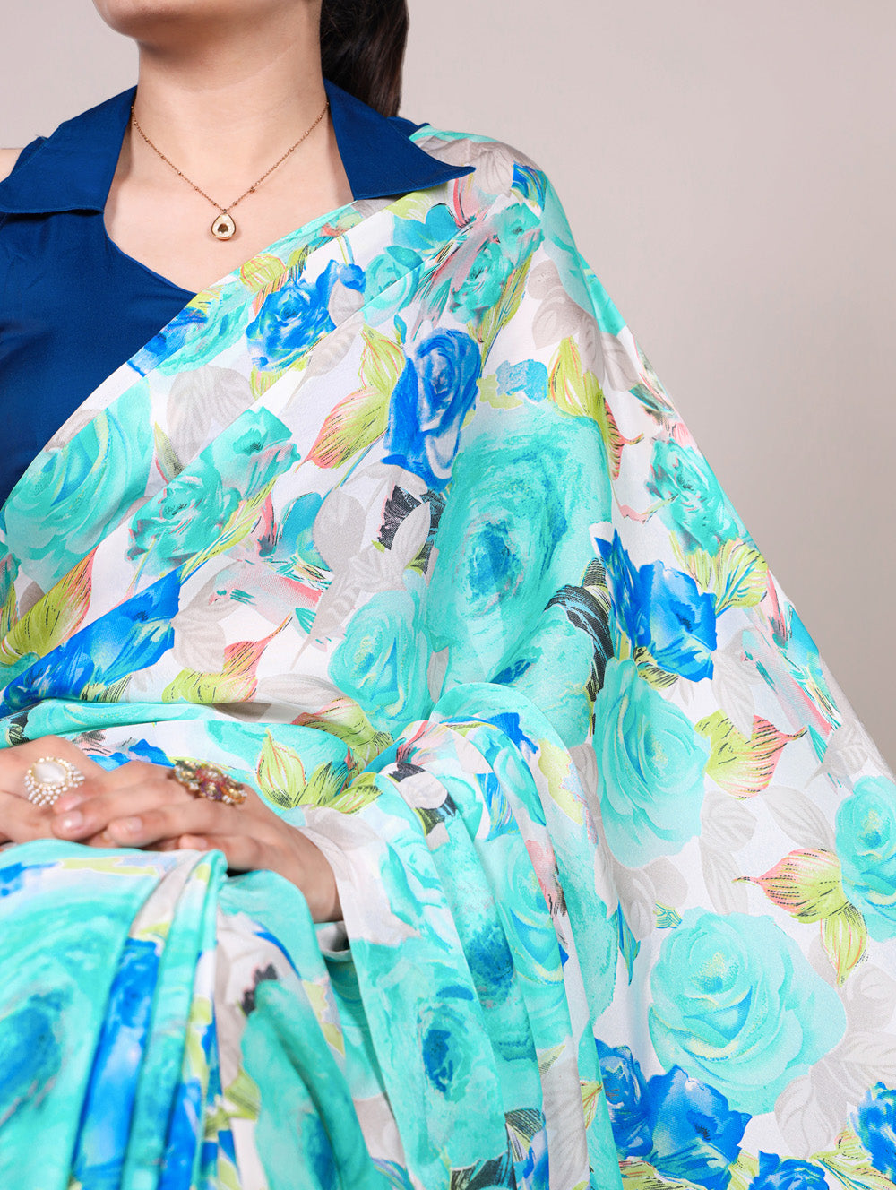 Firozi dull satin floral printed saree with matching blouse and pearl lace border