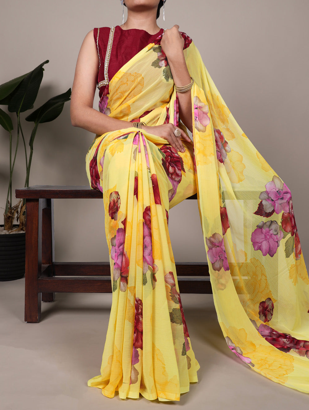 Yellow floral print chiffon saree with red banglory blouse lace border
