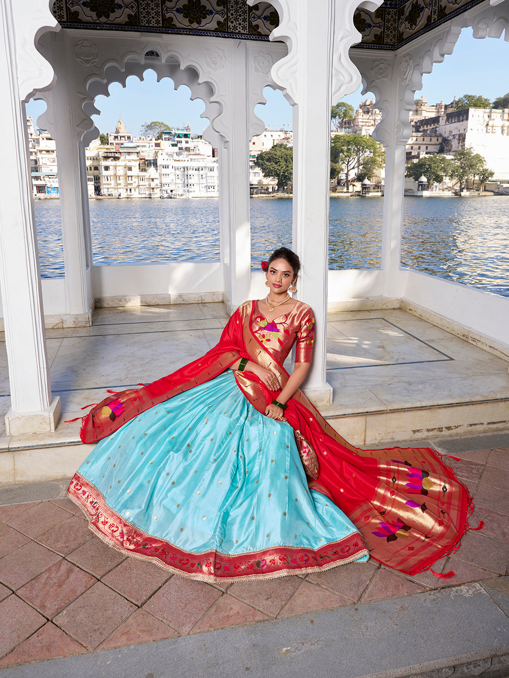 Sky blue jacquard silk lehenga choli with zari weaving matching potli purse