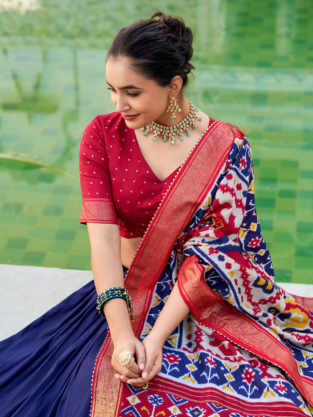 Navy blue tasar silk lehenga choli with ikkat patola print foil work