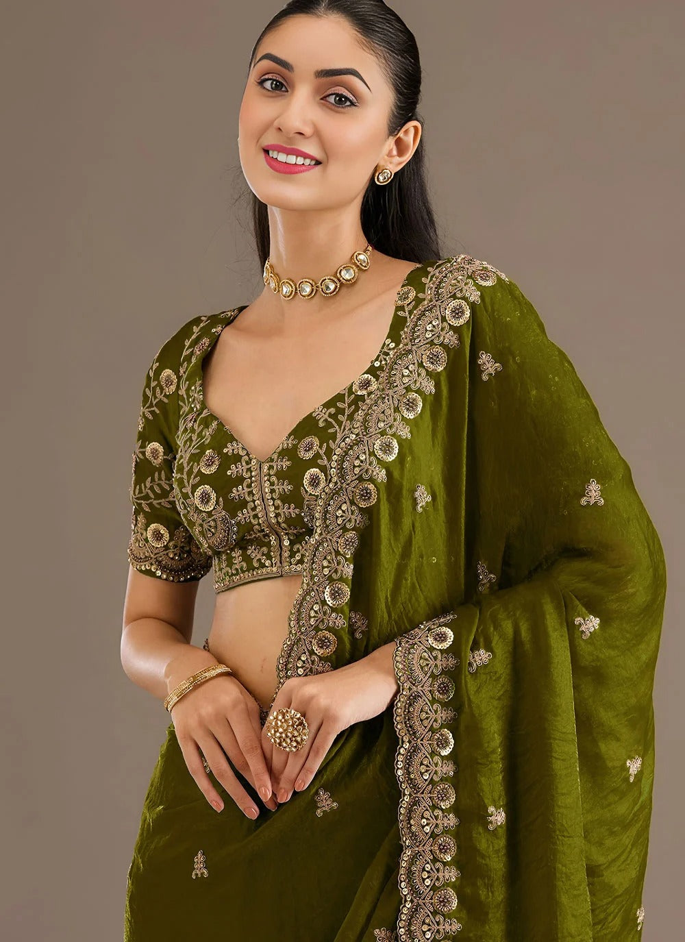 Sophisticated olive green designer tissue silk saree with zari sequins embroidery