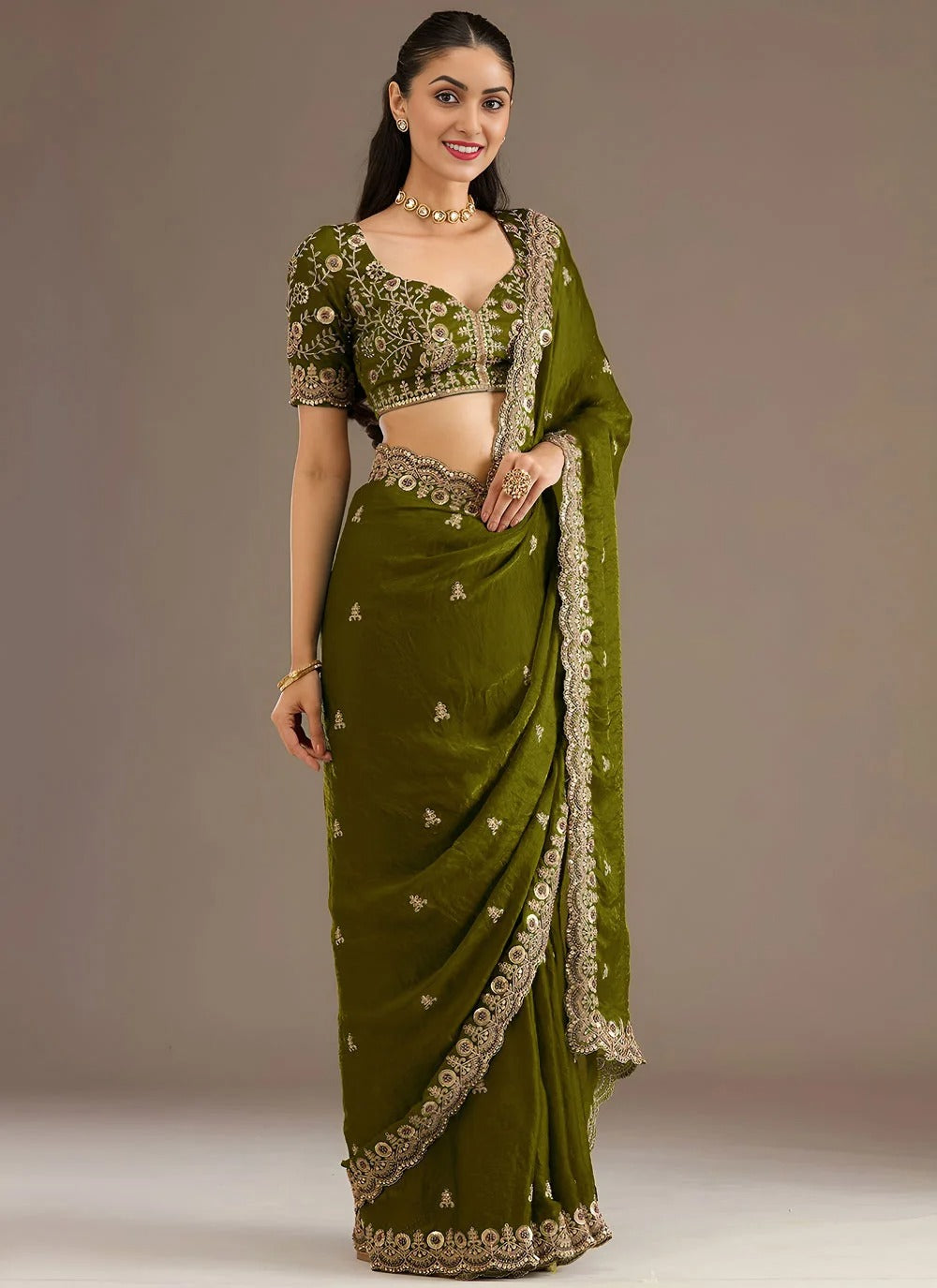 Sophisticated olive green designer tissue silk saree with zari sequins embroidery