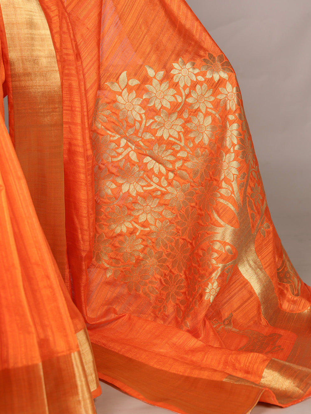 Orange raw silk saree with intricate zari weaving unstitched blouse