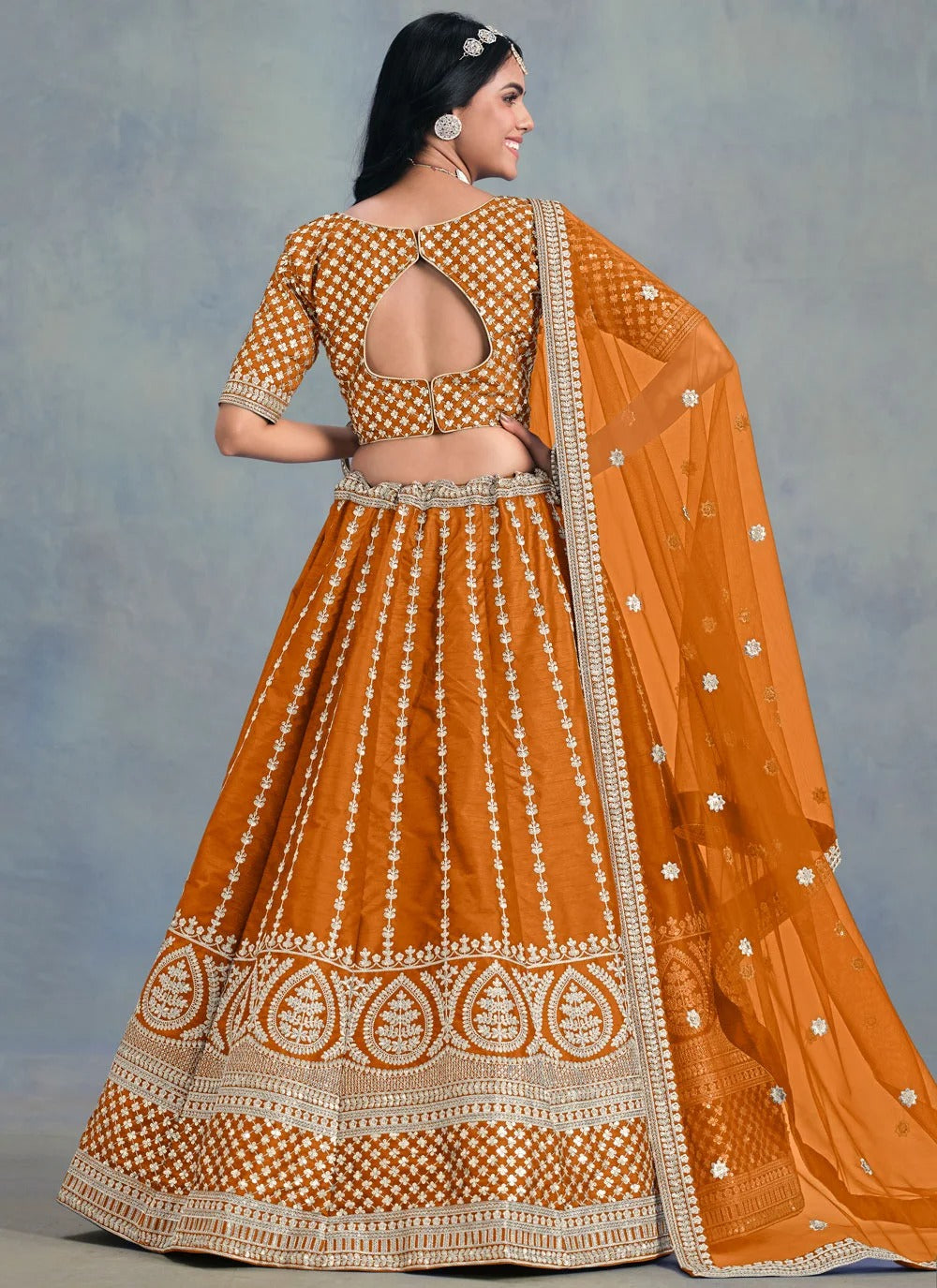 Radiant orange haldi lehenga in art silk with soft net dupatta