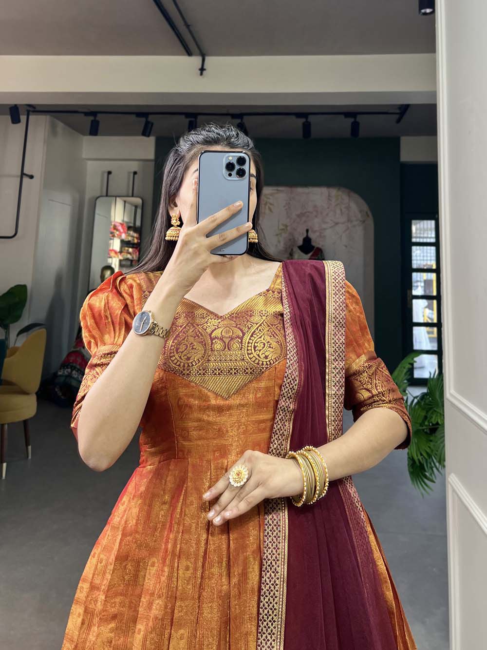 Regal Orange Zari Woven Kanjivaram Gown with Net Dupatta