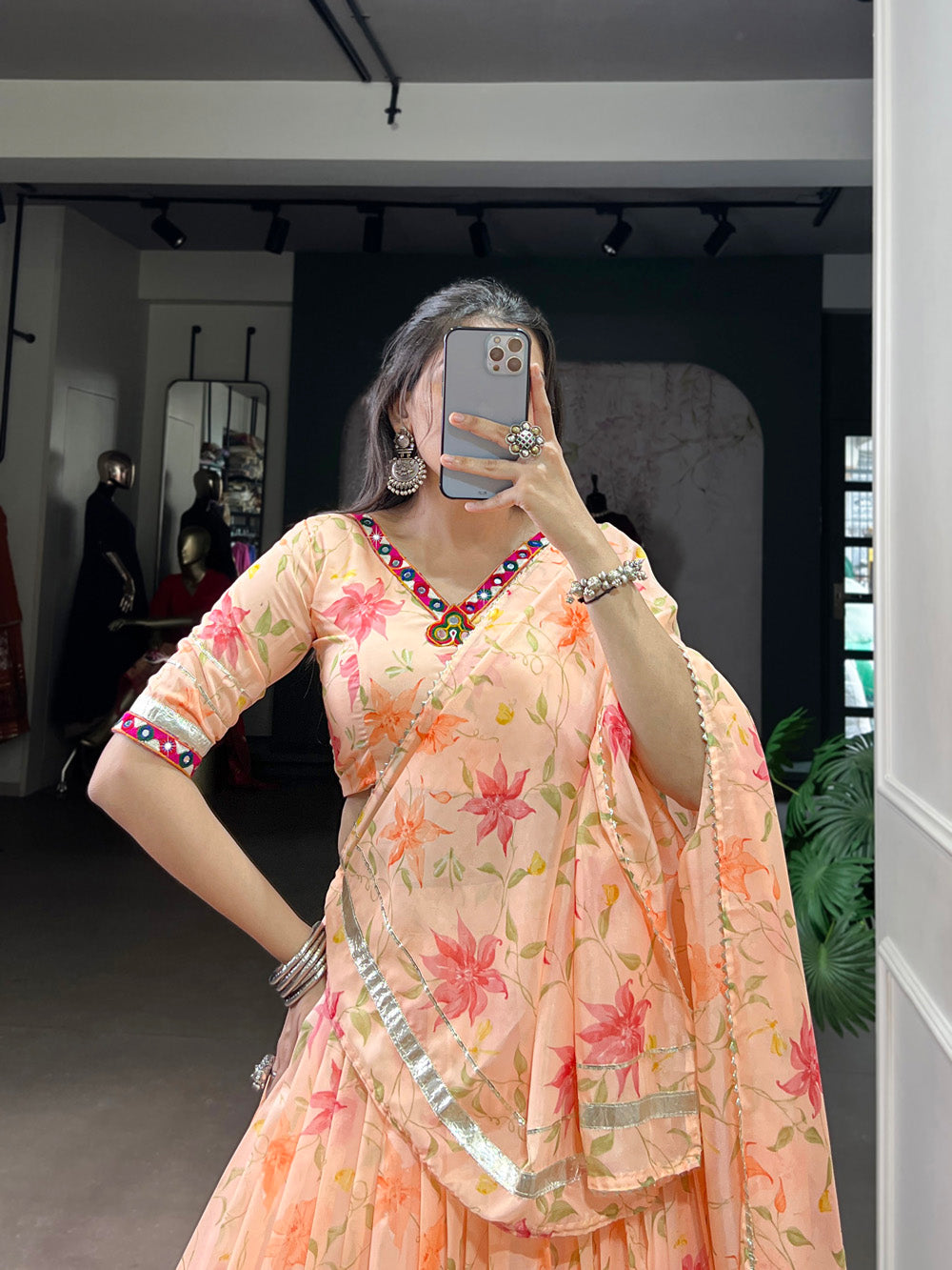 Peach tubby silk floral printed lehenga choli with embossed lace mirror work
