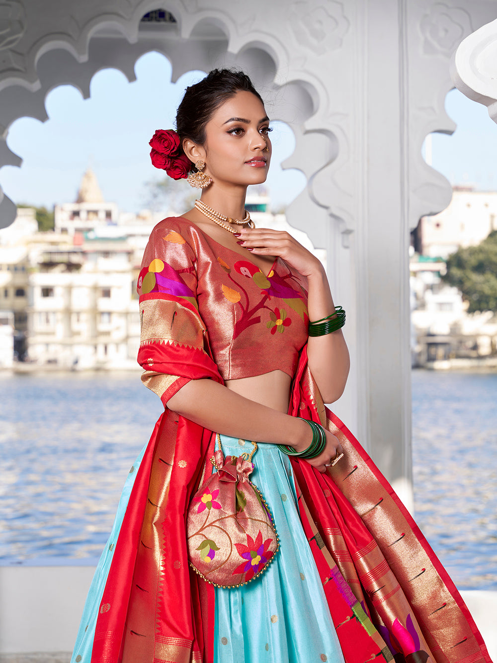 Sky blue jacquard silk lehenga choli with zari weaving matching potli purse