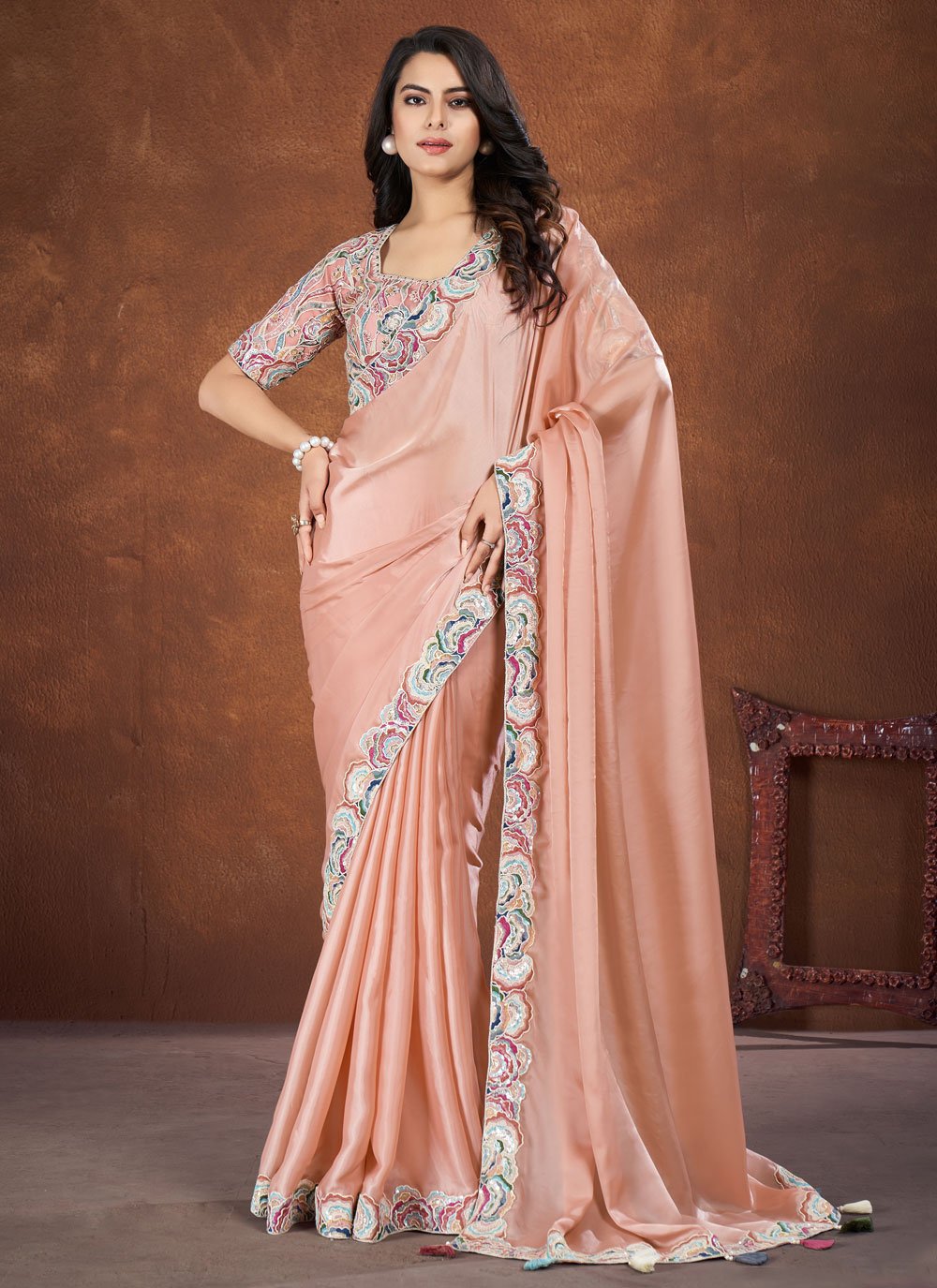 Peach embroidered crepe satin silk saree with net stitched blouse