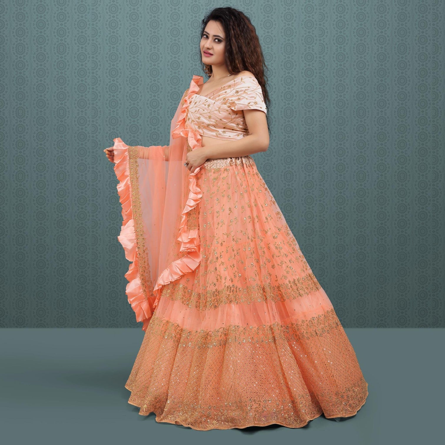 Peach Party Wear Sequins Embroidered Net Lehenga Choli