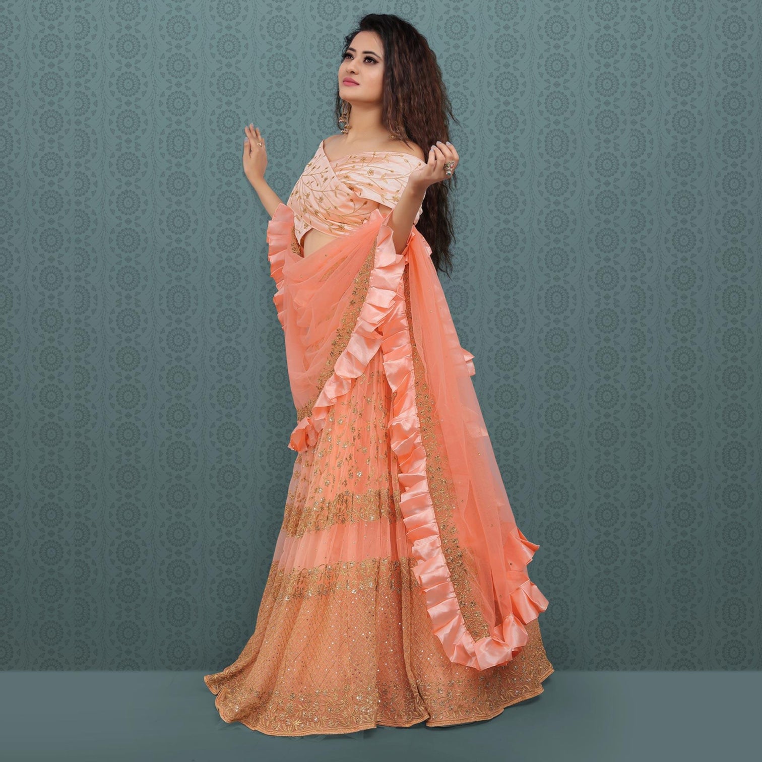Peach Party Wear Sequins Embroidered Net Lehenga Choli
