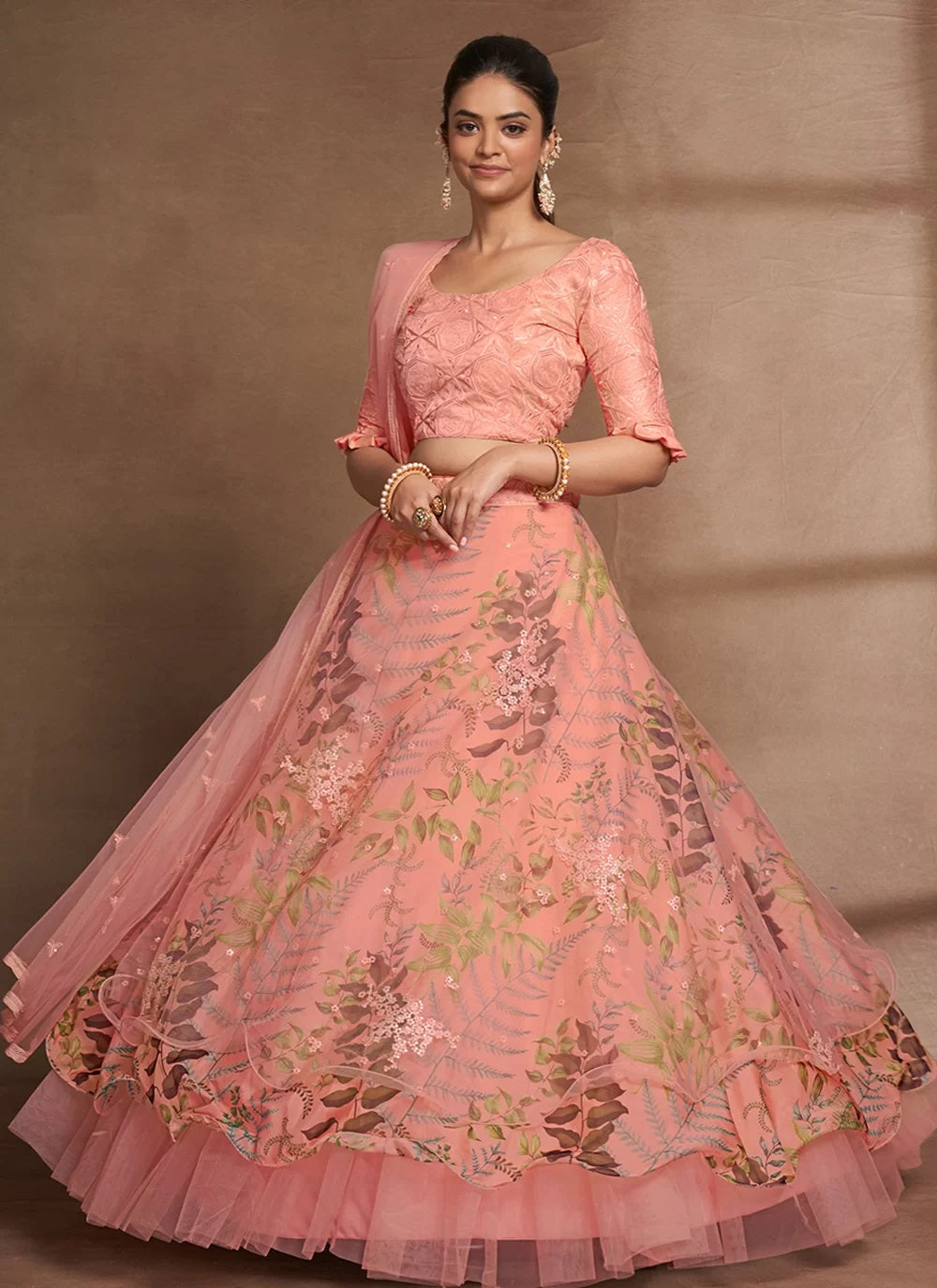 Peach sequins embroidered organza and net lehenga choli