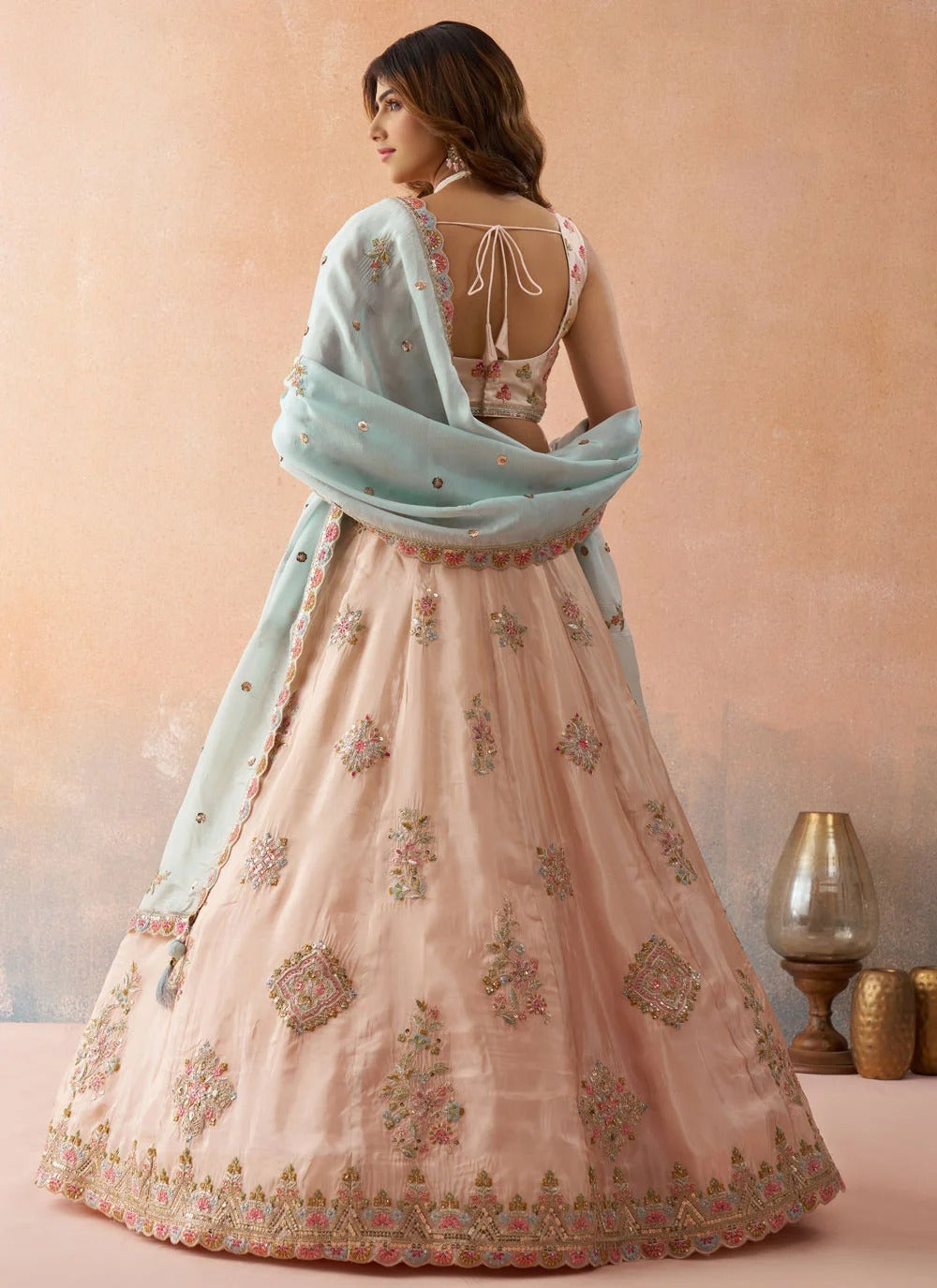 Peach tissue bridal lehenga set with sequins and zari embroidery