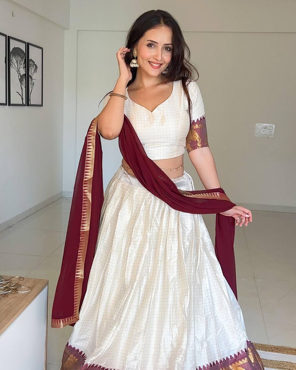 Elegant elephant white checks silk lehenga light shades to complement to create beautiful aura in all function