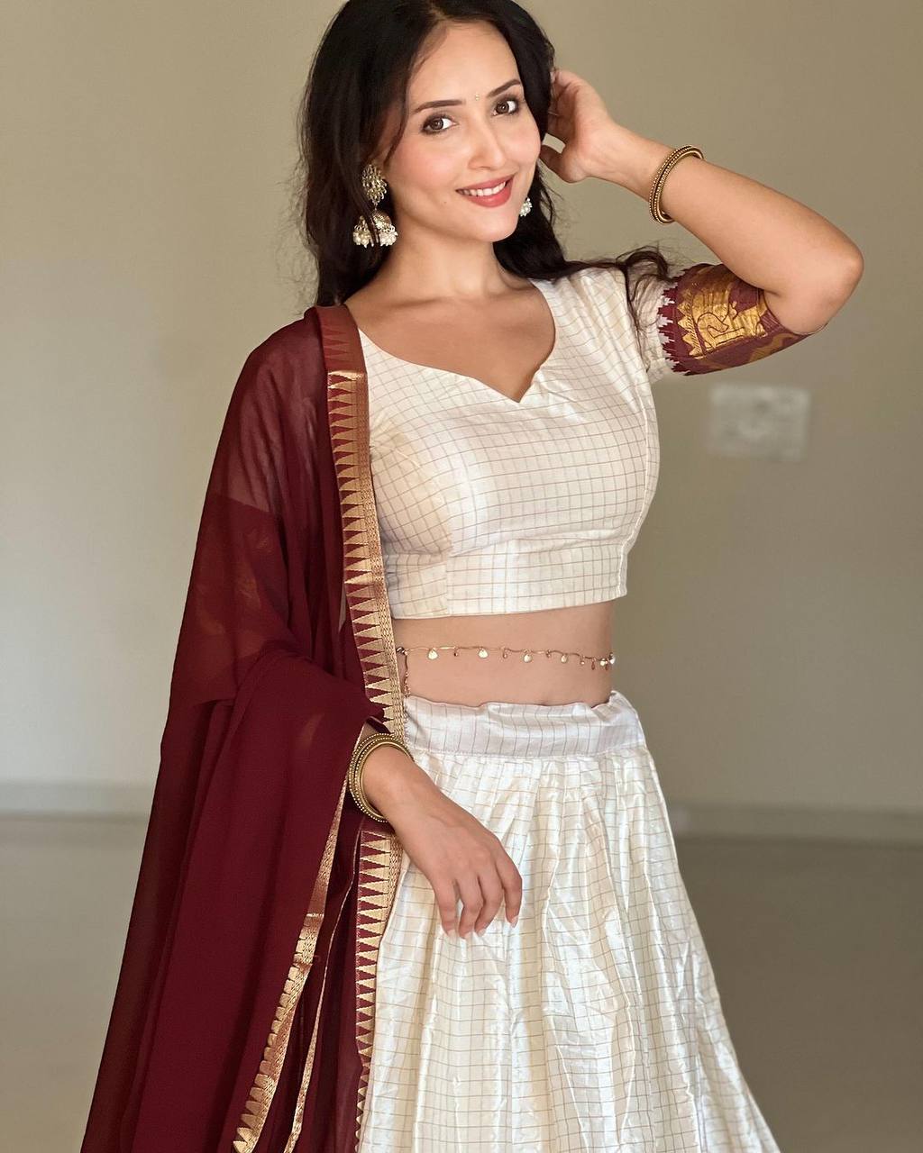 Elegant elephant white checks silk lehenga light shades to complement to create beautiful aura in all function