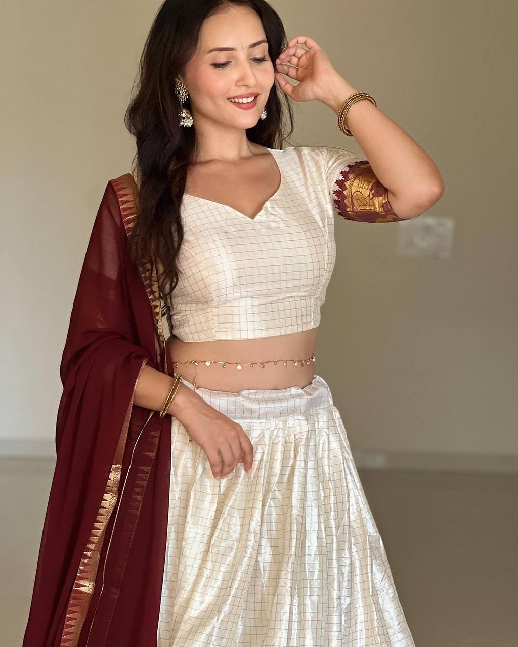 Elegant elephant white checks silk lehenga light shades to complement to create beautiful aura in all function