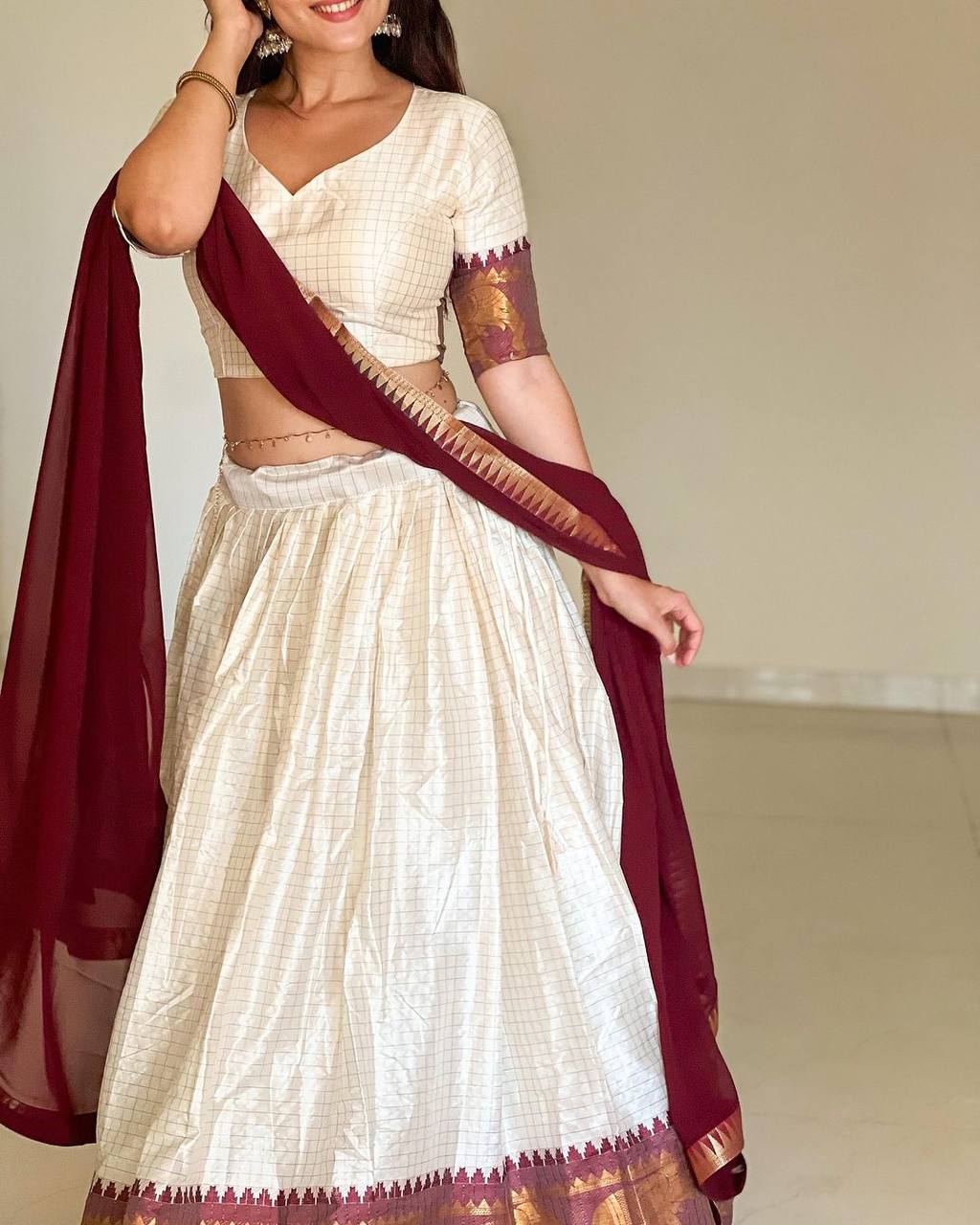 Elegant elephant white checks silk lehenga light shades to complement to create beautiful aura in all function