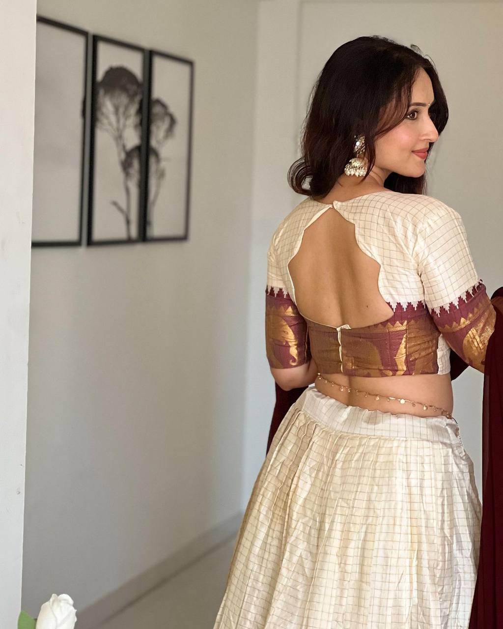 Elegant elephant white checks silk lehenga light shades to complement to create beautiful aura in all function