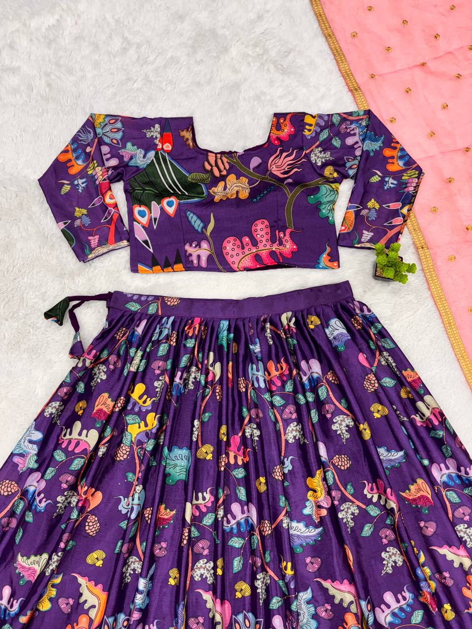 Traditional purple kalamkari lehenga set with peacock motif and pink dupatta