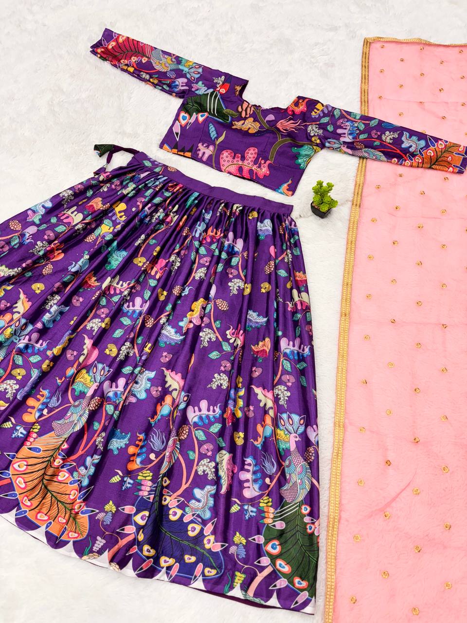 Traditional purple kalamkari lehenga set with peacock motif and pink dupatta