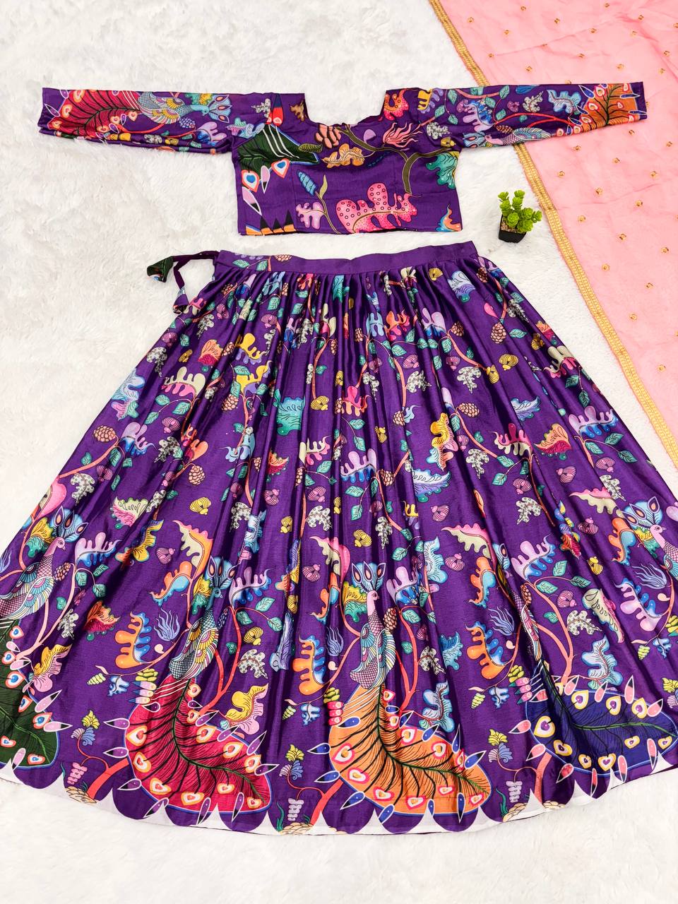 Traditional purple kalamkari lehenga set with peacock motif and pink dupatta