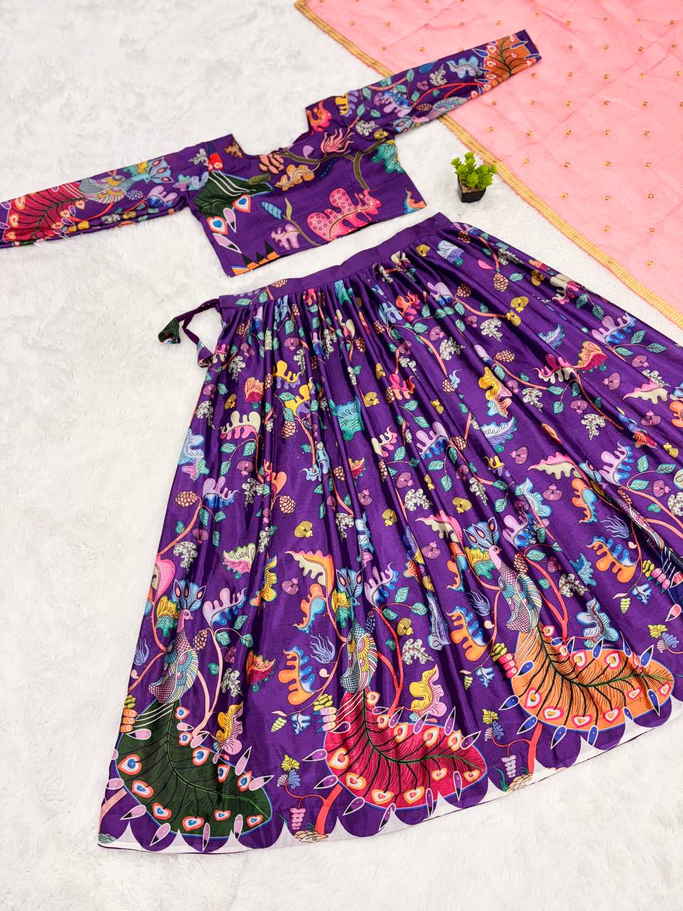 Traditional purple kalamkari lehenga set with peacock motif and pink dupatta