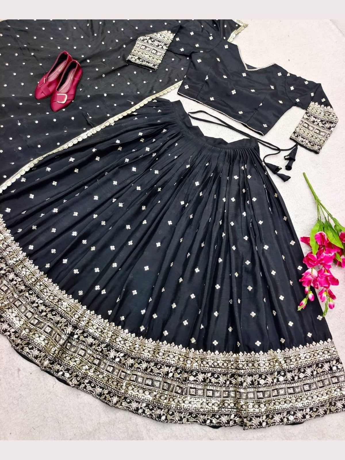 Elegant Black Silk Lehenga Choli with Heavy Gold Embroidered Border & Dupatta