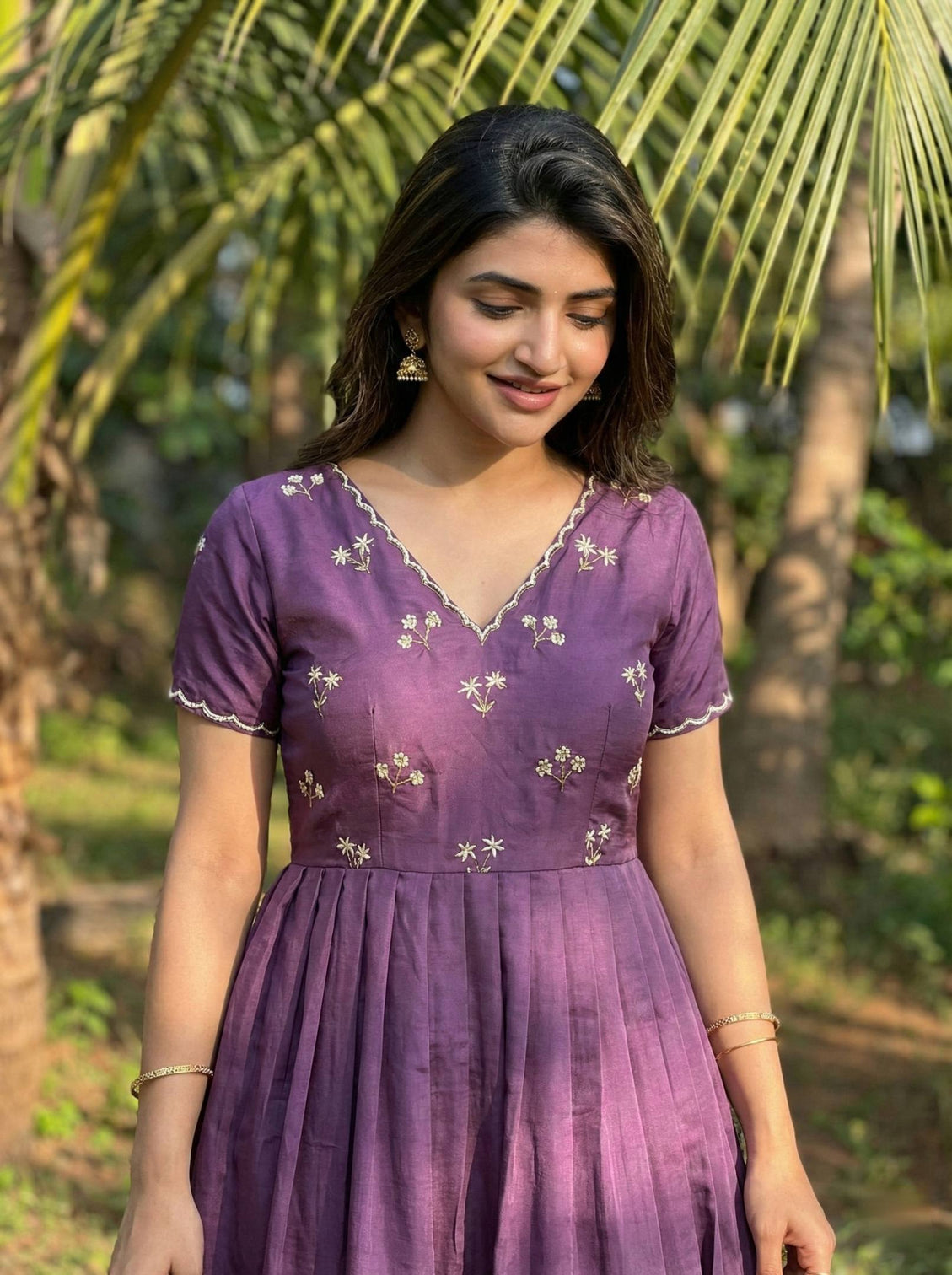 Wine purple designer ethnic gown for women with moti kardana hand embroidery