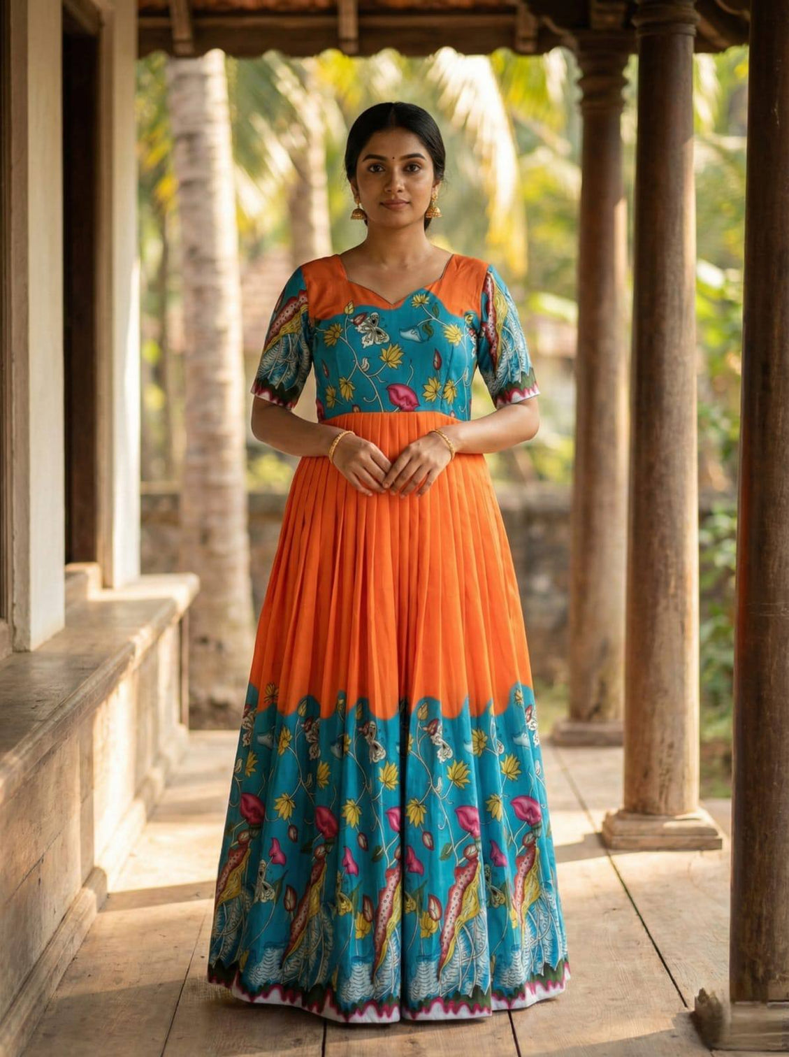 Teal orange kalamkari print maslin gown with flared silhouette mameraa
