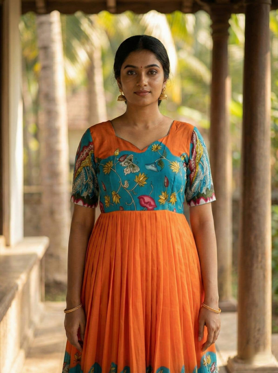 Teal orange kalamkari print maslin gown with flared silhouette