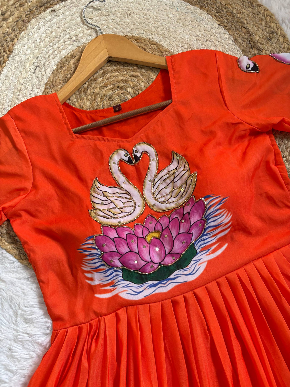 Radiant orange muslin gown with hand painted swan khatli art