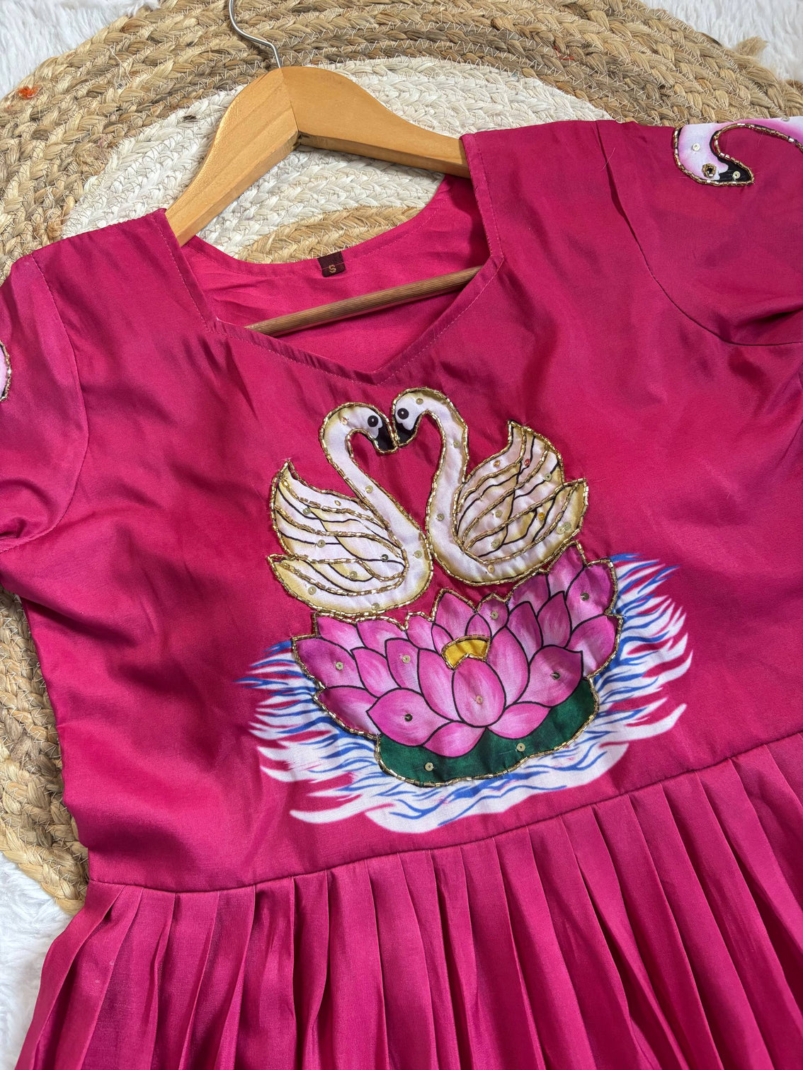 Graceful pink muslin gown with swan art khatli handwork