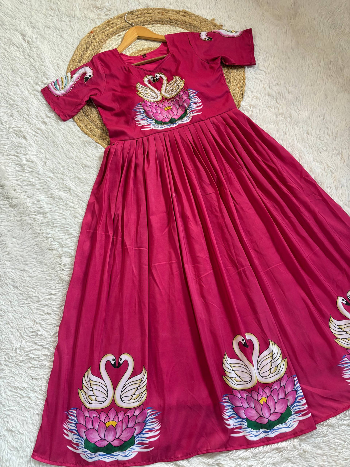 Graceful pink muslin gown with swan art khatli handwork
