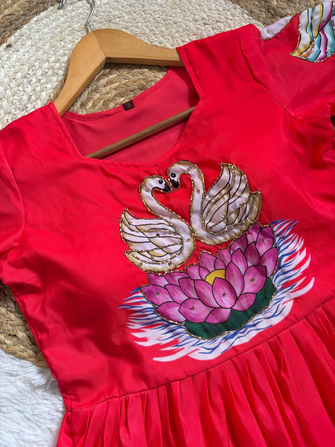 Radiant red muslin gown with artisanal swan khatli handwork