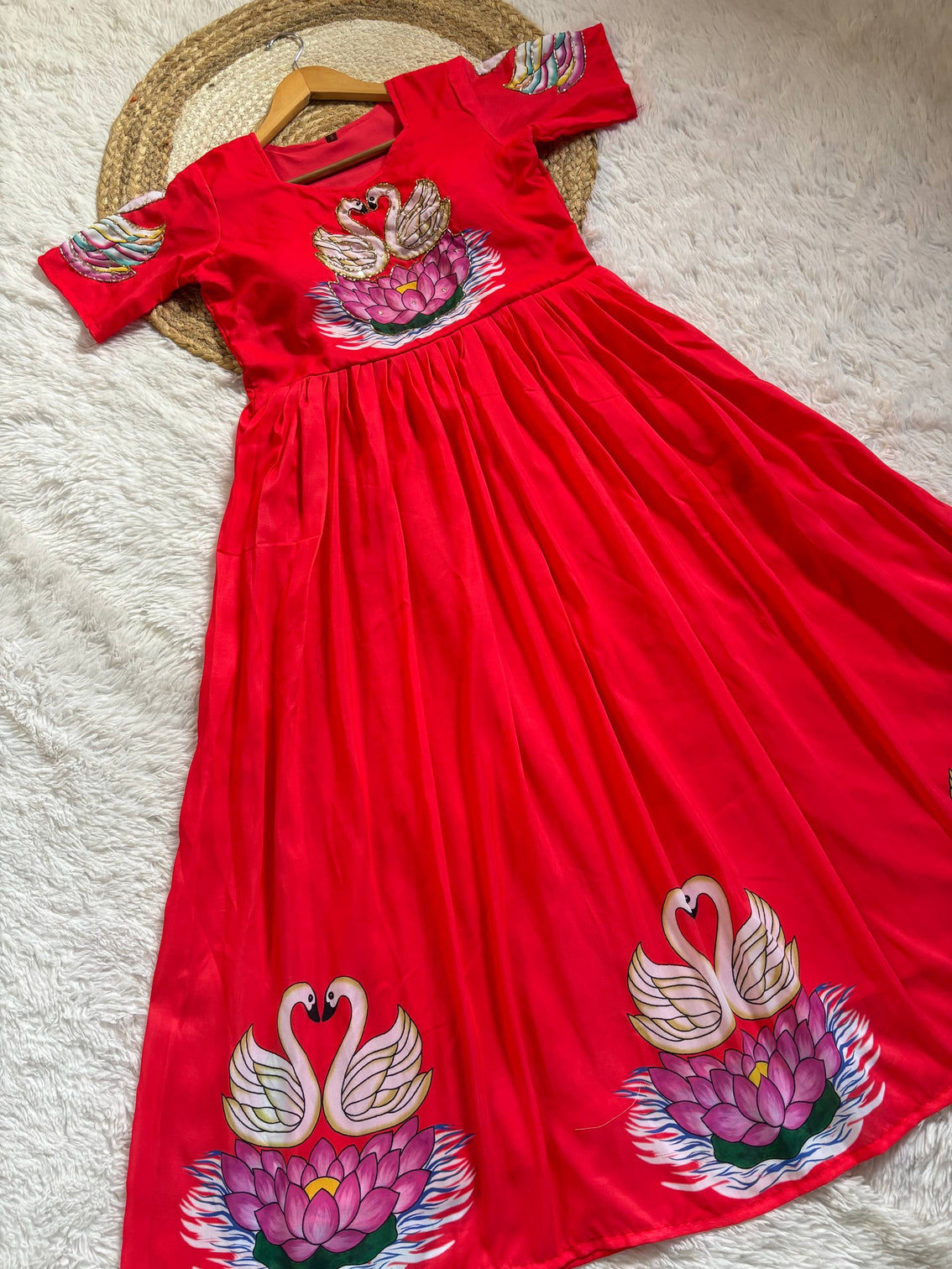 Radiant red muslin gown with artisanal swan khatli handwork