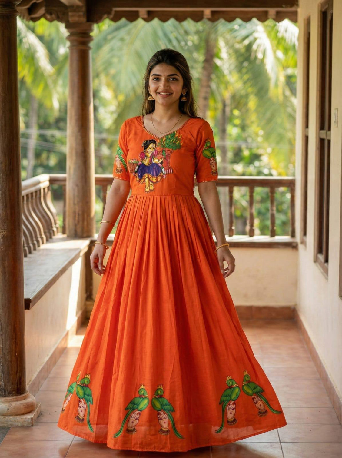 Orange kalamkari printed maslin gown with khatli handwork moti beads mameraa